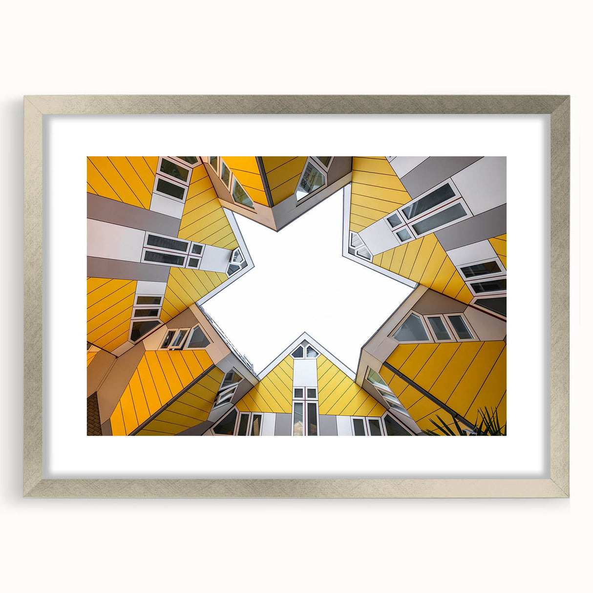 Extra large abstract art print of a European scenery in a silver frame, featuring textured shades of blue and gray.
