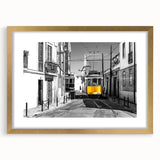 Abstract art print of Lisbon scenery in muted gold and blue tones on a framed canvas, suitable for dining room decor.