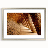 Extra large abstract art print of Barcelona scenery in muted earth tones on a textured canvas, framed in silver.