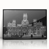 Large abstract wall art depicting a colorful Madrid cityscape on a black framed acrylic, ideal for modern living room decor.