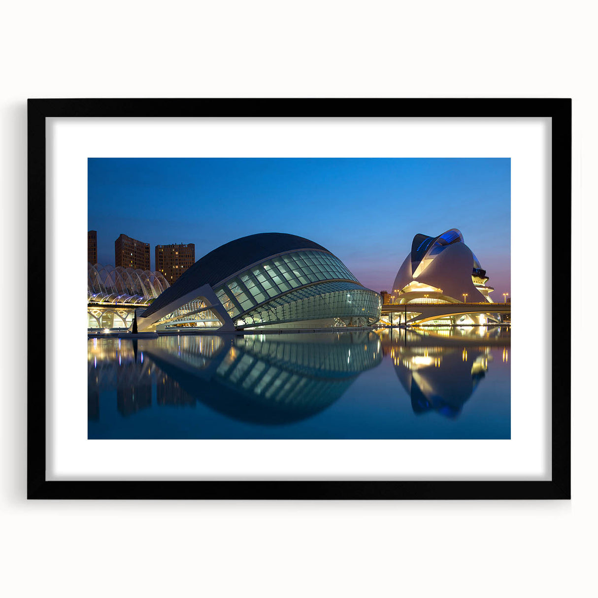 Colorful abstract art print of Valencia scenery in black frame, featuring vibrant hues and textures.