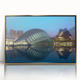 A large art print depicting a mid-century modernist scene of Valencia with muted gold and blue tones on a framed acrylic.