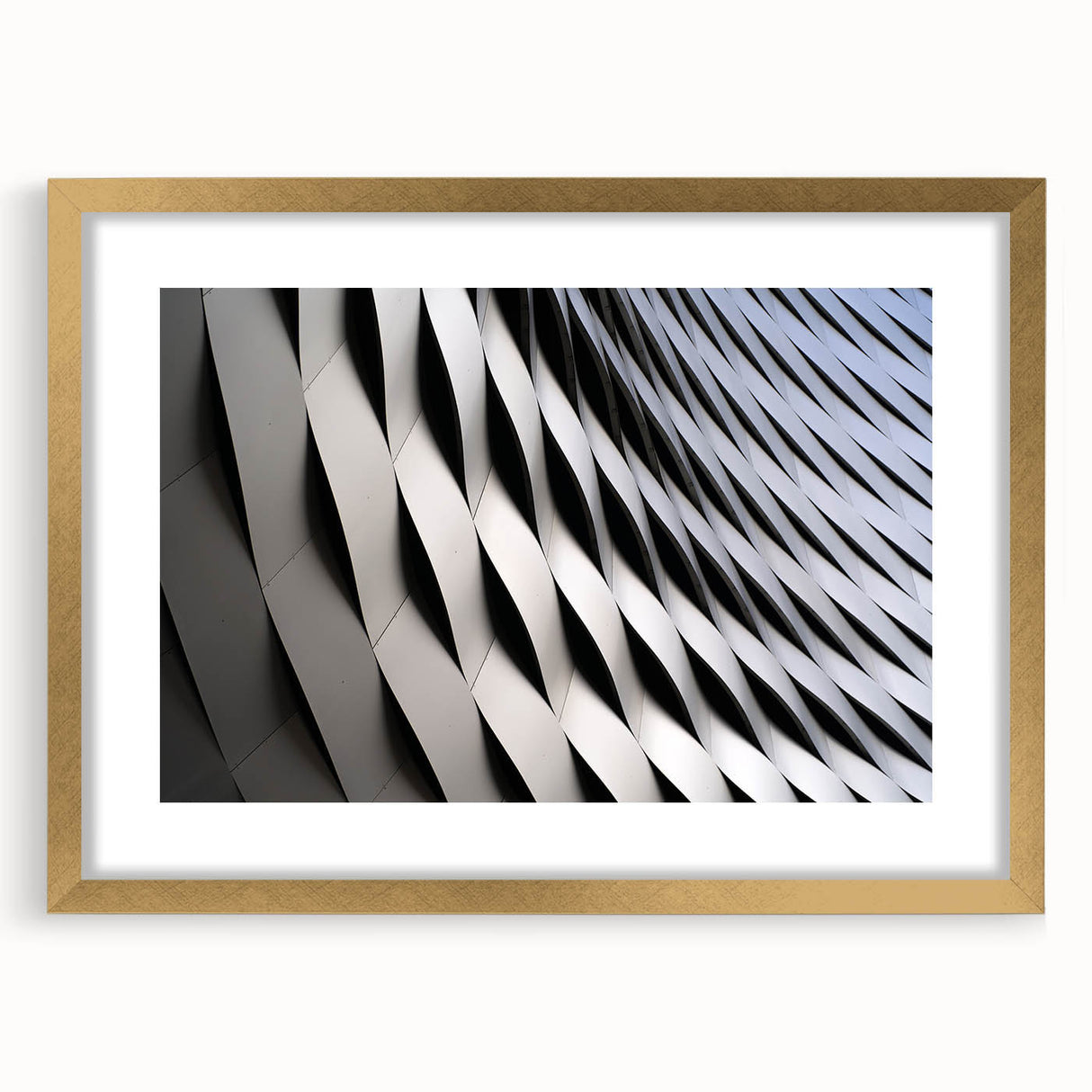 Extra large abstract art print of a European landscape in muted gold and green tones, framed with a mat.