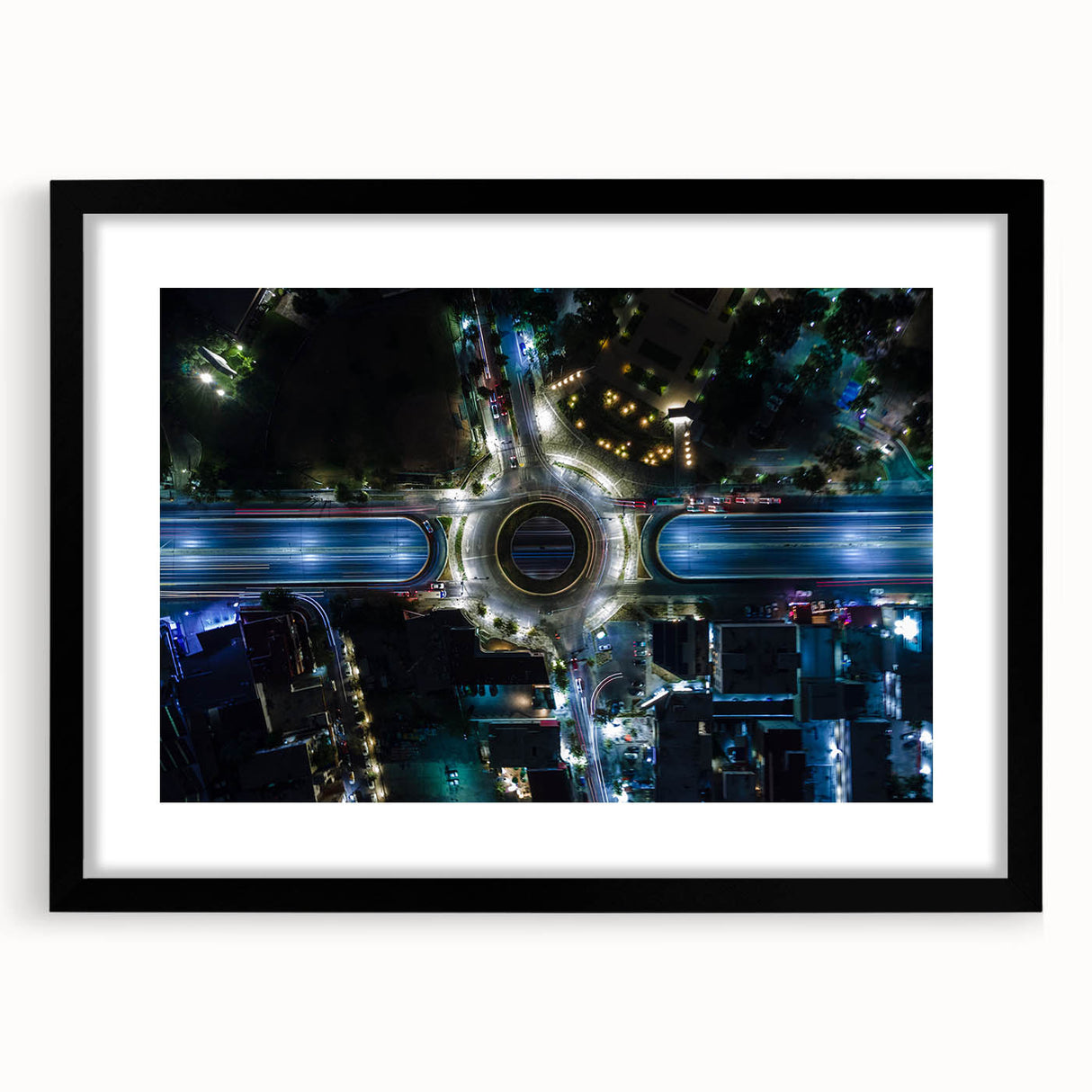 Abstract art print of Mexico City in vibrant colors on textured canvas, framed in black, ideal for living room decor.