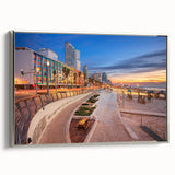 Framed canvas of Tel Aviv landscape in vintage poster style, featuring colorful art on a black background.