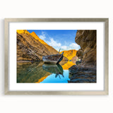 Textured abstract art print of a Middle Eastern scenery in muted earth tones, framed in silver, ideal for bedroom decor.