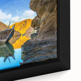Extra large framed canvas featuring a textured depiction of a Middle Eastern scenery in black with colorful accents.