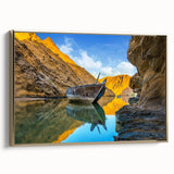 Framed canvas depicting a vintage-style landscape of Oman in muted gold and black tones, ideal for bedroom wall decor.