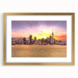 Extra large abstract art print of Auckland scenery in muted gray and blue tones on a gold-framed canvas.