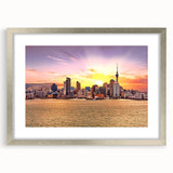 Textured abstract art print of Auckland skyline in muted blue and silver tones on a framed canvas.