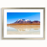 Textured abstract art print of a Bolivian landscape in muted earth tones, framed in silver, ideal for bedroom art.