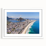 Abstract art print of a stylized Brazilian landscape in blue and green hues on a framed white mat.