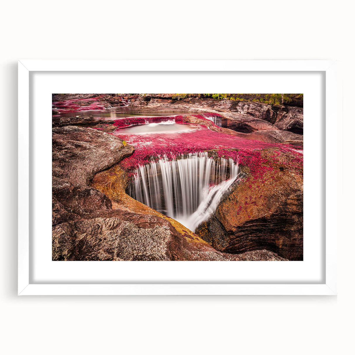 Abstract art print of a vibrant Colombian landscape in muted earth tones, framed with a white mat.