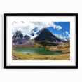 Colorful abstract art print of a stylized South American landscape, using textured colors, in a large black frame.