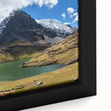 Framed canvas featuring a textured depiction of a Peruvian landscape in black with colorful accents.