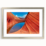 Textured art print of Arizona's Coyote Buttes in muted earth tones on a framed silver mat, suitable for bedroom decor.