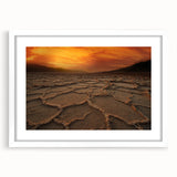 Abstract art print of Death Valley in muted earth tones on a framed white mat, suitable for dining room decor.