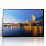 Large abstract wall art of Sacramento's skyline in muted grays and blues, framed in black acrylic.