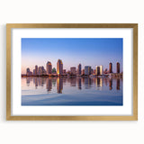 Extra large abstract art print of San Diego skyline in muted gray and blue tones, framed with a gold mat.