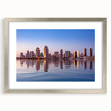 Textured abstract art print of San Diego scenery in muted blue and gray tones, framed in silver, suitable for bedroom art.