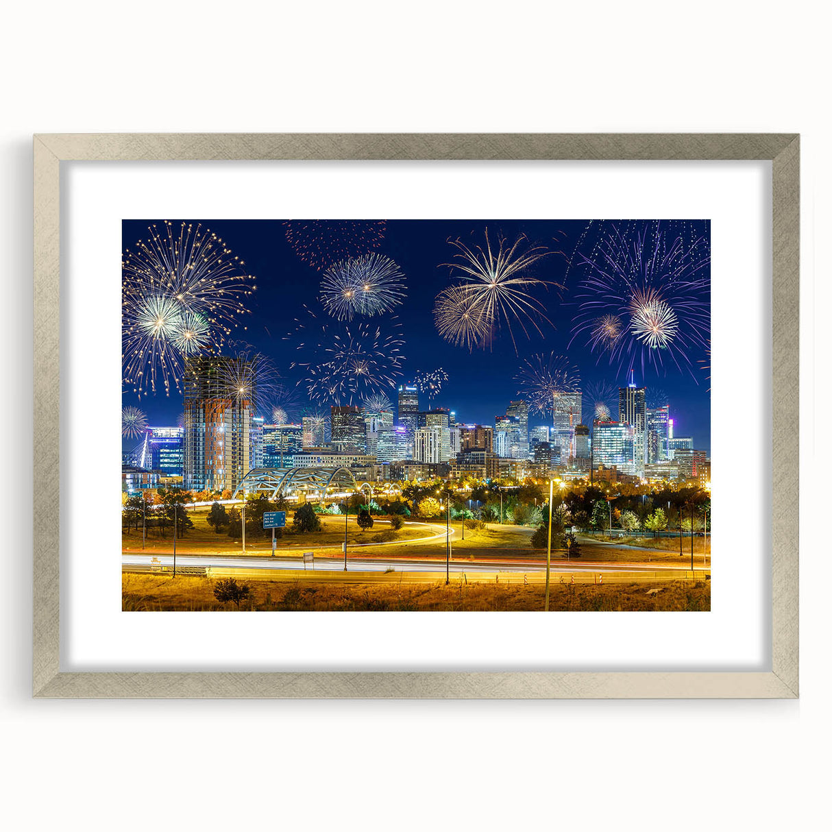 Textured art print depicting an abstract Denver skyline in muted earth tones on a framed silver mat.
