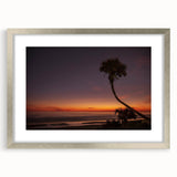 Textured abstract art print featuring muted earth tones, framed in silver, ideal for bedroom wall decor.