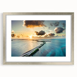 Textured abstract art print depicting the Florida Keys in muted blue and green tones, framed with a silver mat.