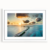 Abstract art print of Florida Keys scenery in muted blue and green tones, framed with a white mat.