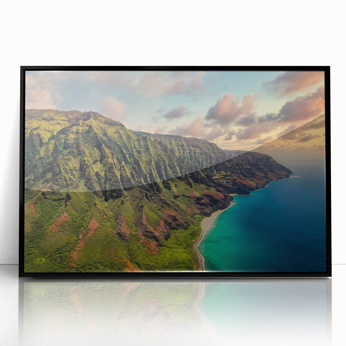 Large abstract wall art depicting the Kauai landscape in vibrant green and blue tones, framed in black acrylic.