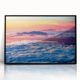 Large abstract wall art depicting a Maui scenery in muted blue and green tones, framed in black acrylic.