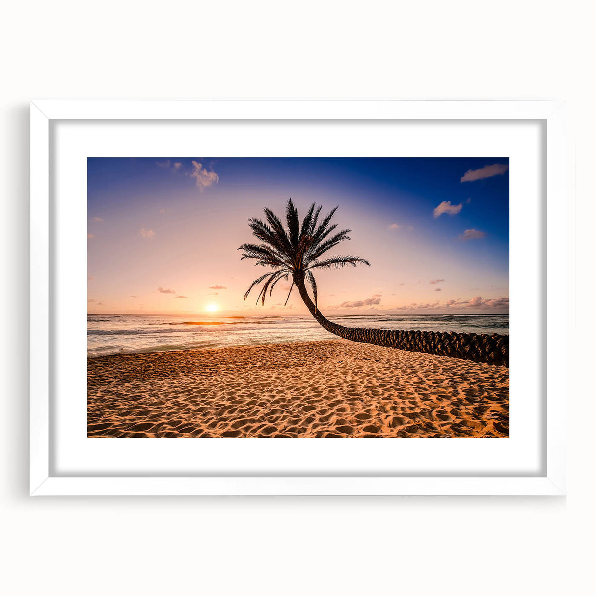 Abstract art print of a beach scene in muted blue and beige tones on a framed white mat, ideal for dining room decor.