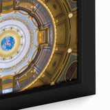 Close-up of textured black wall art depicting Iowa scenery on a framed canvas, with vibrant color accents.