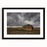 Extra large abstract art print of a colorful Kansas scenery on a textured canvas, framed in black.