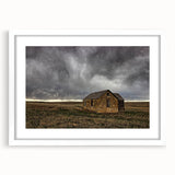 Abstract art print of Kansas scenery in muted green and blue shades, framed with a white mat, ideal for dining room decor.