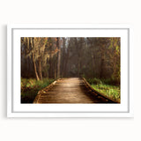 Abstract art print of Louisiana scenery in muted greens and blues on a white framed canvas, ideal for dining room decor.