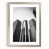 Textured art of abstract Detroit skyline in muted gray and blue tones on a framed silver mat, suitable for bedroom decor.