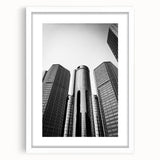Abstract art print of Detroit skyline in muted gray and blue tones on a framed white mat, ideal for dining room decor.