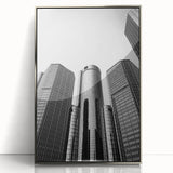 Mid-century modernist art of Detroit skyline in silver framed acrylic, with muted gray and blue tones.