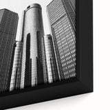 Framed canvas of Detroit skyline in textured black with vibrant color accents, ideal for living room decor.