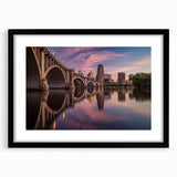 Extra large abstract art print of Minneapolis skyline in vibrant, colorful hues on a black framed canvas.