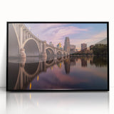 Large abstract wall art depicting the Minneapolis skyline in muted gray and blue tones on a framed acrylic print.