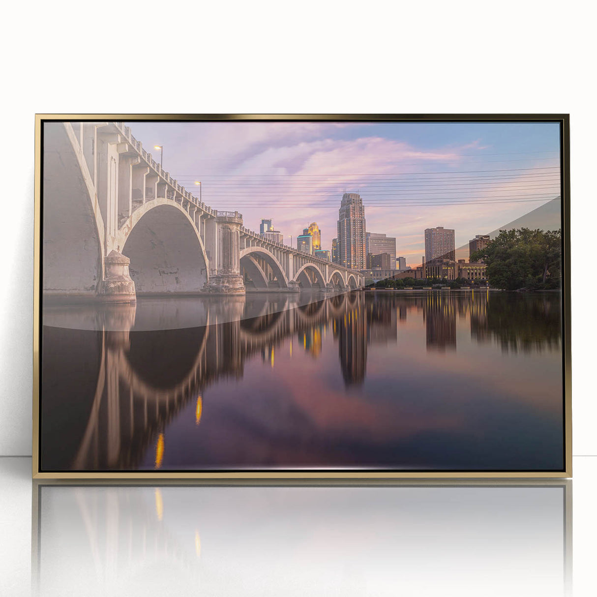 Acrylic print of Minneapolis skyline in muted gold and blue tones, framed, ideal for modern art wall decor.