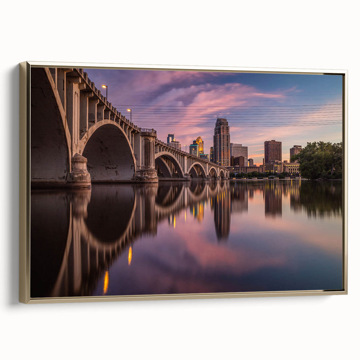 Framed canvas depicting a vintage-style Minneapolis landscape in black and gold tones, ideal for bedroom wall art.