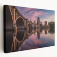 Minneapolis skyline depicted in muted blue and gray tones on a large stretched canvas, suitable for kitchen wall art.