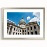 Textured abstract art print of St. Louis scenery in muted earth tones on a framed silver mat, suitable for bedroom decor.