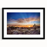 Abstract art print depicting a vibrant, textured New Mexico scenery in a large, black-framed mat.