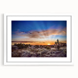 Abstract art print depicting a New Mexico landscape in muted earth tones on a framed white mat, ideal for dining room decor.