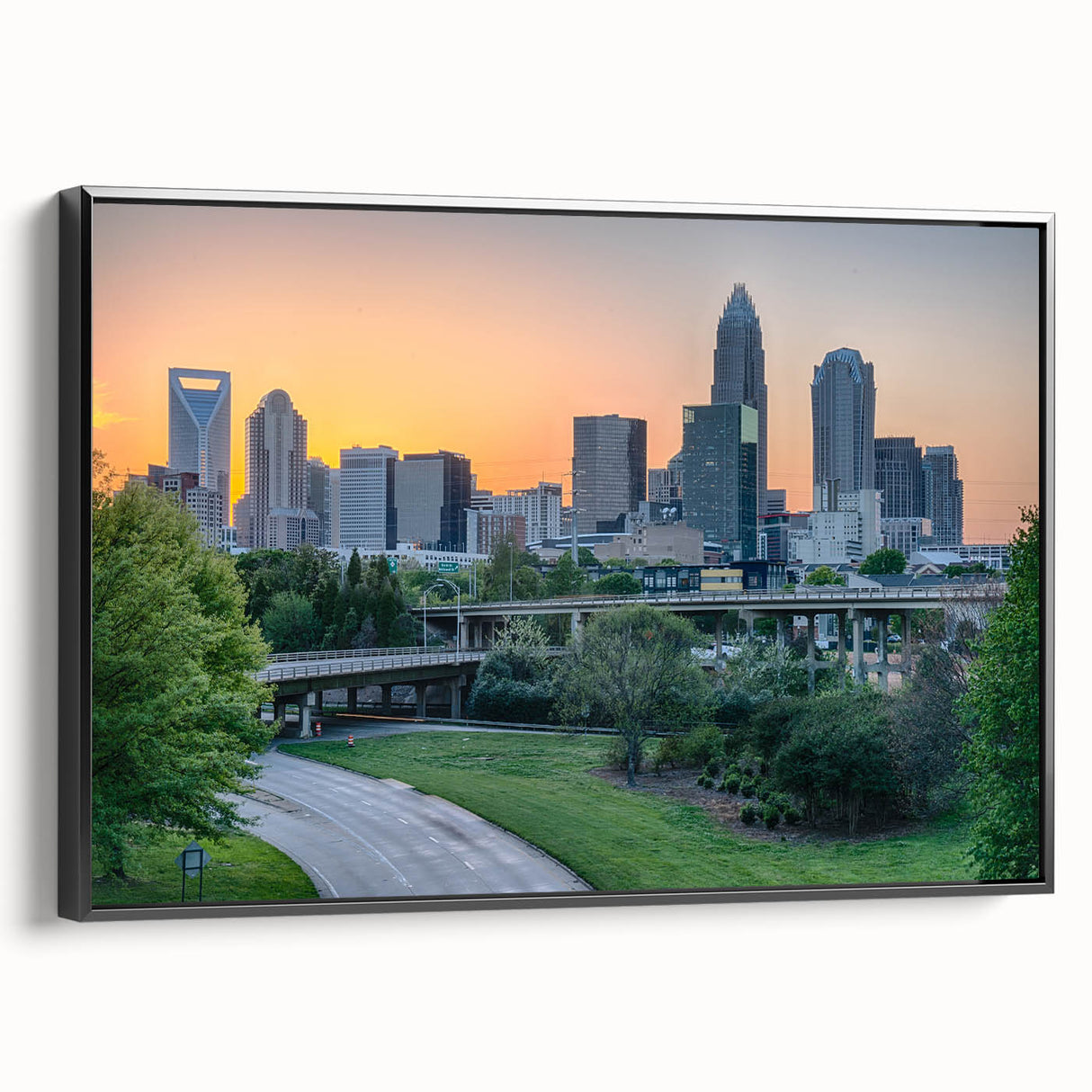 Black and white framed canvas of Charlotte, North Carolina skyline, ideal for bedroom wall art.