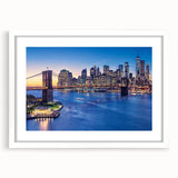 Abstract art print of Manhattan skyline in muted gray and blue tones on a framed white mat.