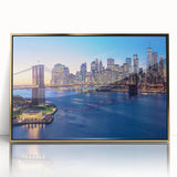 Acrylic print of Manhattan skyline in gold and black tones, framed, reflecting mid-century modernist style.